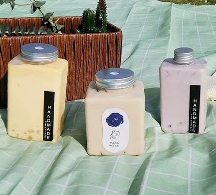 Moderne undichte Quadrat- und Rundmilch-Tee-Flaschen mit Griff